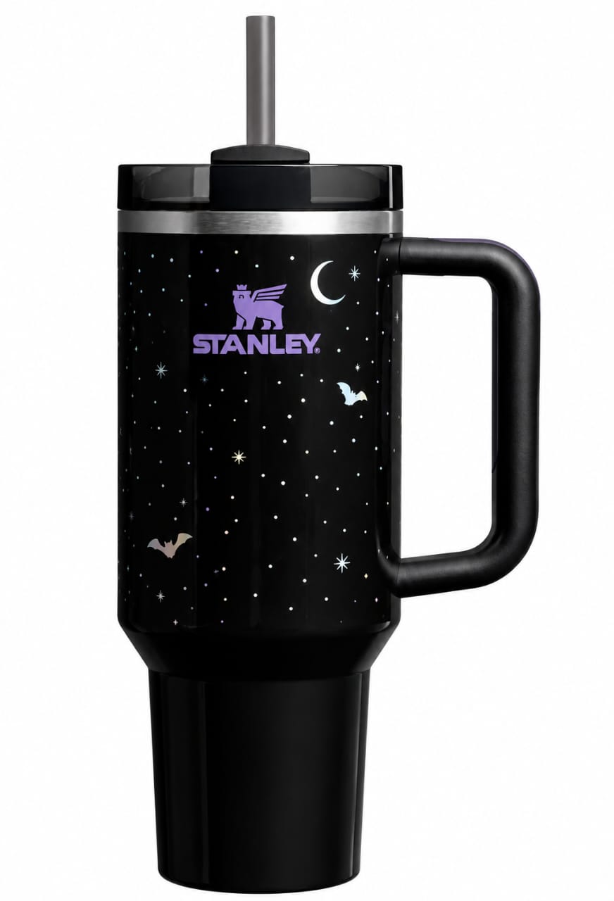 Black handled tumbler with a starry night design, crescent moon, bat graphics, purple logo, dark lid, and reusable straw.