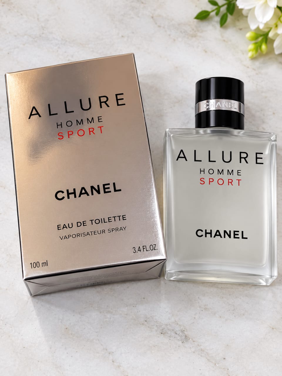 Chanel Allure Homme Sport Eau de Toilette 100 ml silver fragrance bottle with black cap and matching presentation box.
