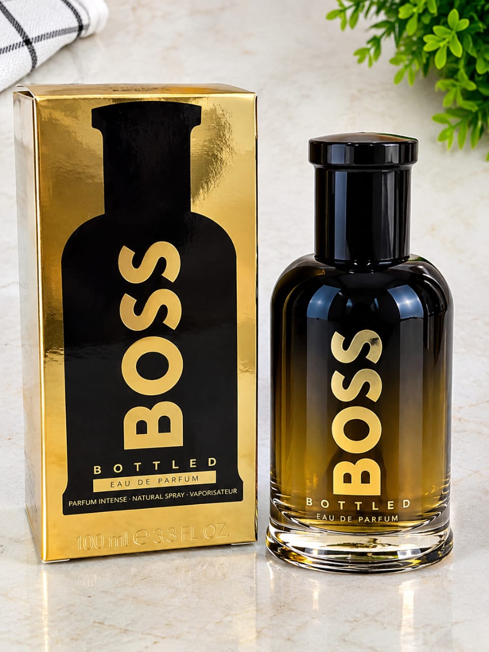 Hugo Boss BOSS Bottled Eau de Parfum for Men, 3.3 oz (100 ml), with dark glass perfume bottle and gold presentation box.