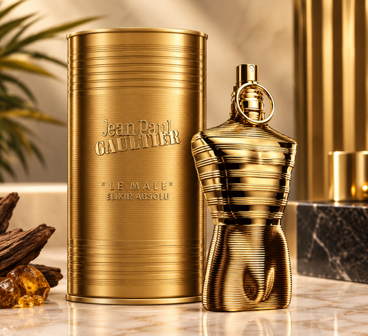 Jean Paul Gaultier Le Male Elixir Absolu gold men's fragrance bottle with matching cylindrical gold presentation case.