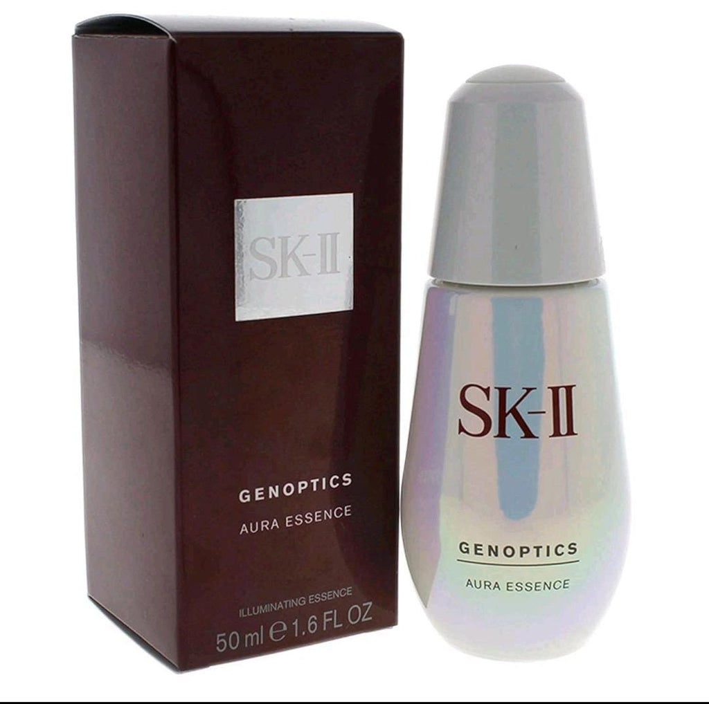 SK-II GenOptics Aura Essence illuminating facial serum in an iridescent bottle with a dark burgundy box, 50ml / 1.6 fl oz.