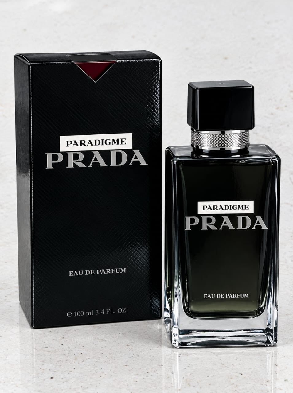 Prada Paradigme Eau de Parfum 100 ml black perfume bottle and matching luxury presentation box.