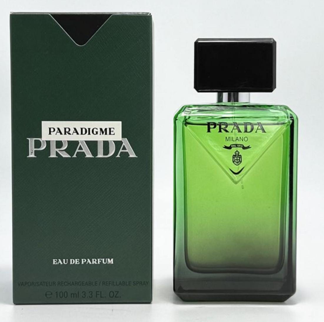  Prada Paradigme Eau de Parfum for Men 3.3 oz 100 mL green perfume bottle with matching dark green box.