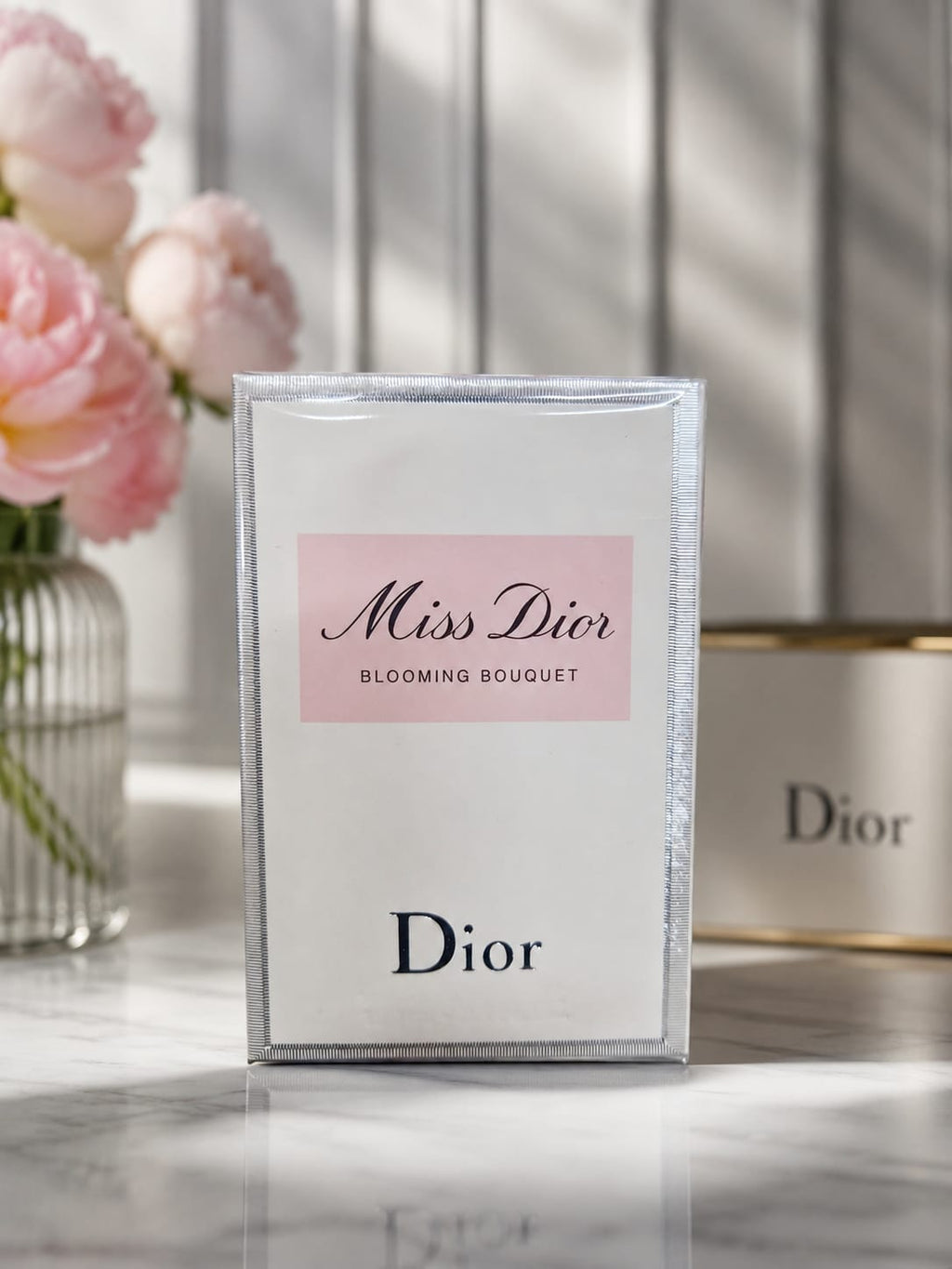 Miss Dior Blooming Bouquet women's floral fragrance in elegant white and pink packaging.