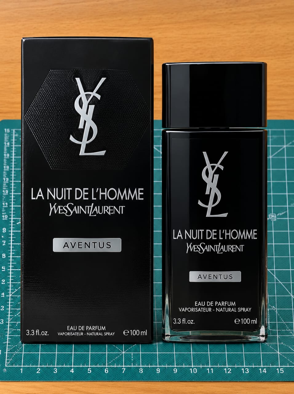 Black men's Eau de Parfum bottle and matching box displaying silver branding and 100 ml 3.3 fl oz packaging.